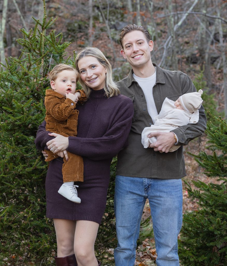 Family portraits showcase parents and children enjoying Christmas tree farm mini sessions in West Milford, New Jersey.